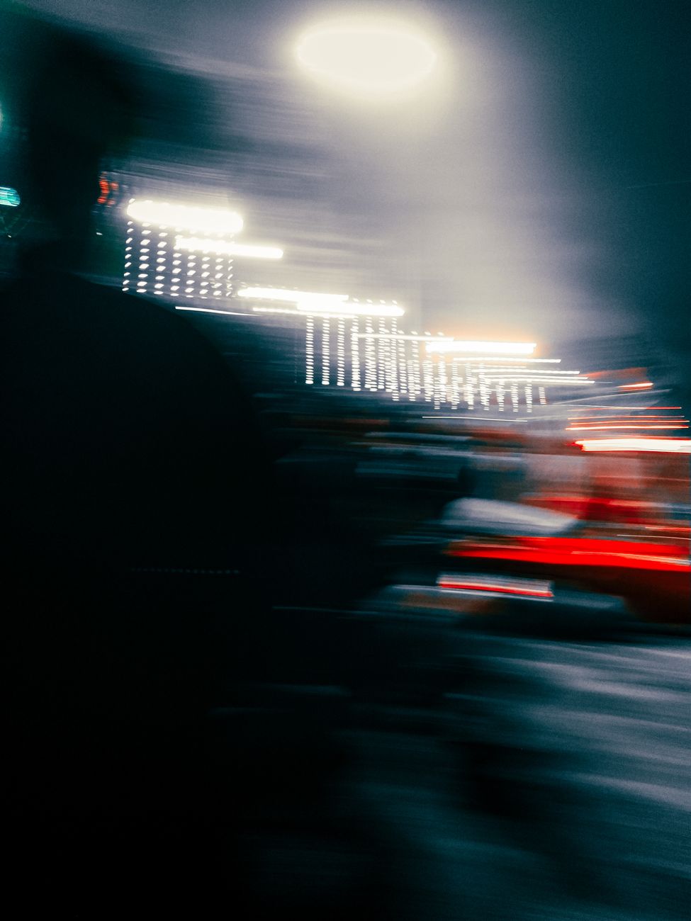 blur photo of a person and lights