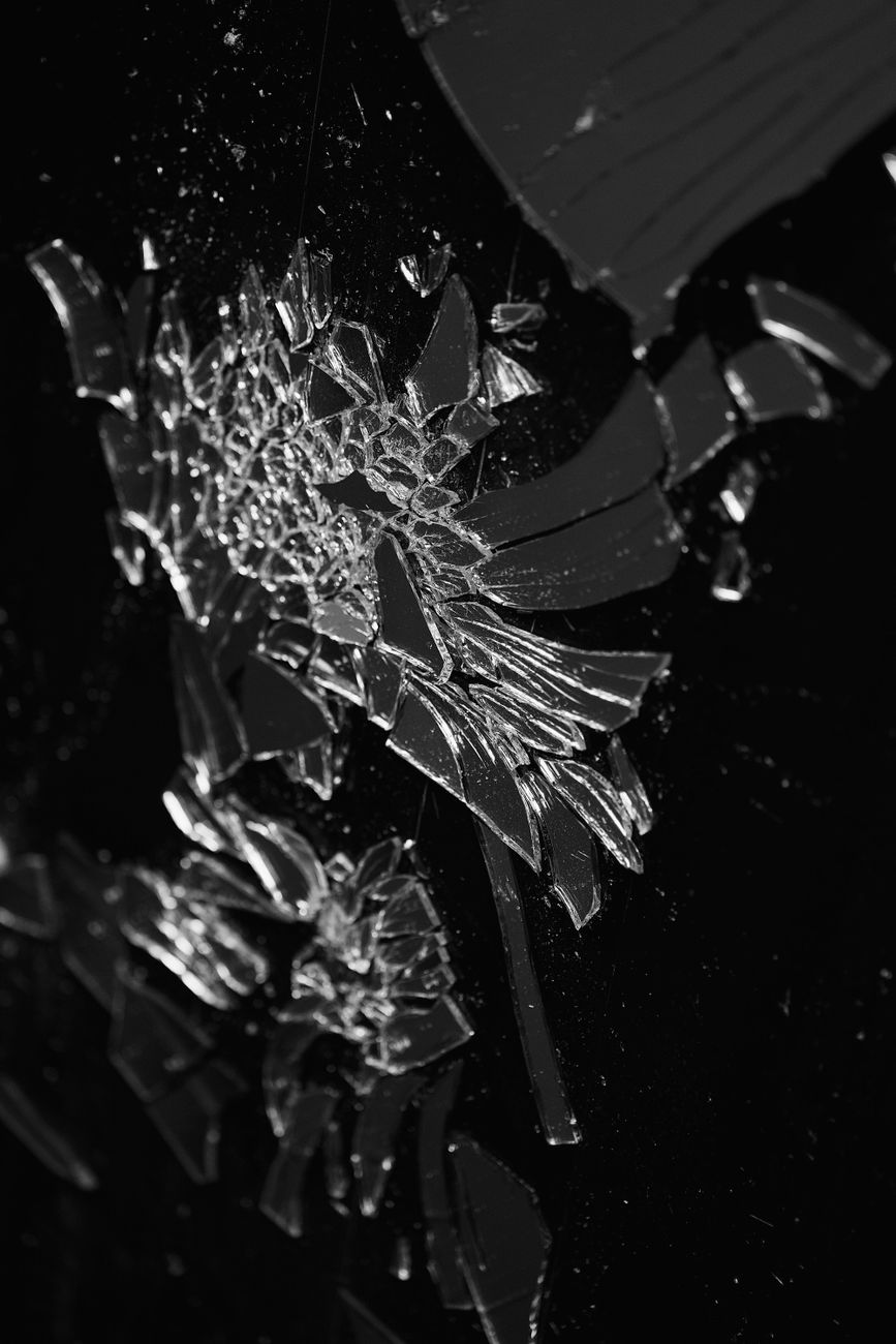 abstract broken glass shard pattern on black