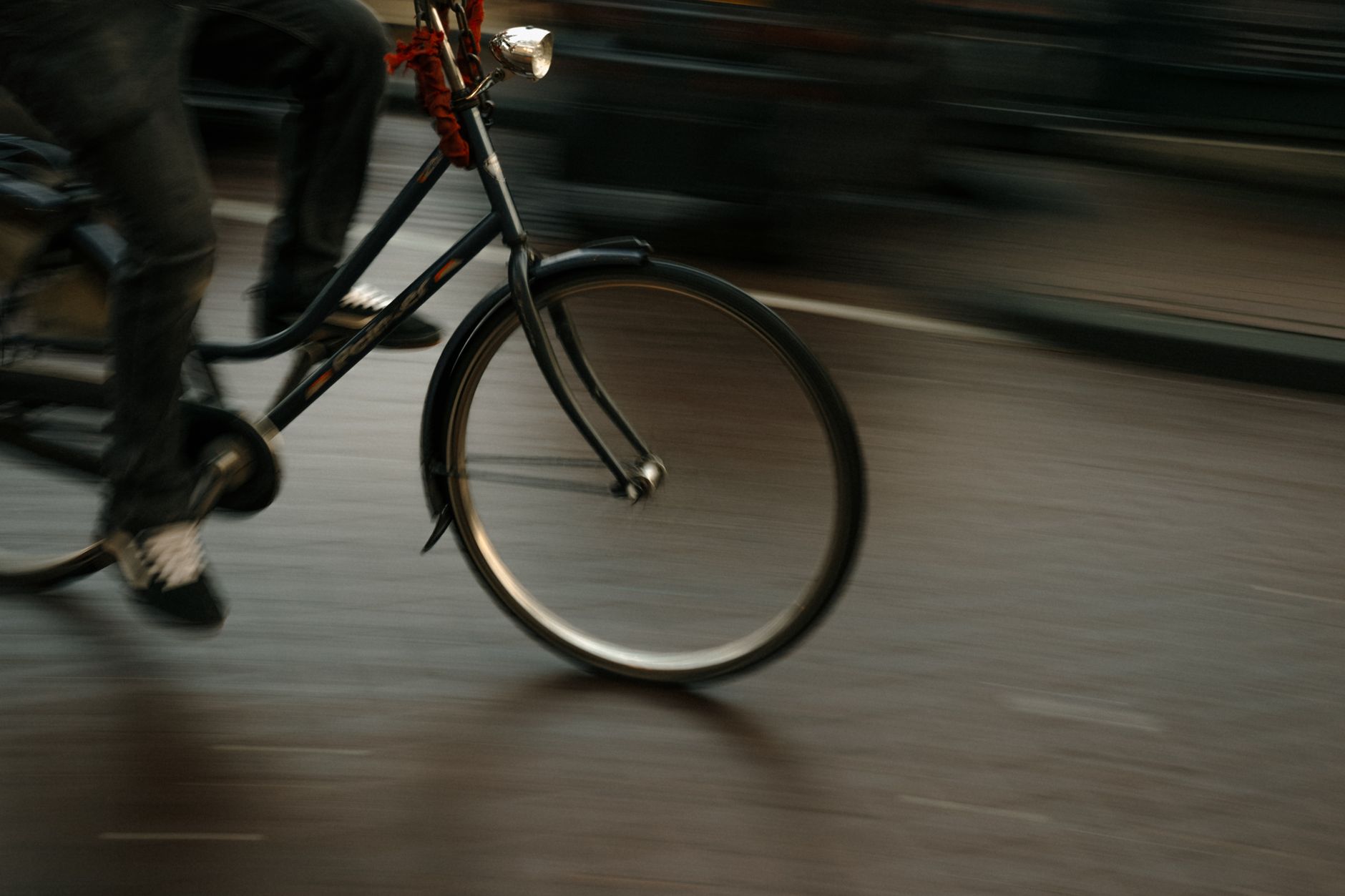 dynamic cyclist in motion on amsterdam streets