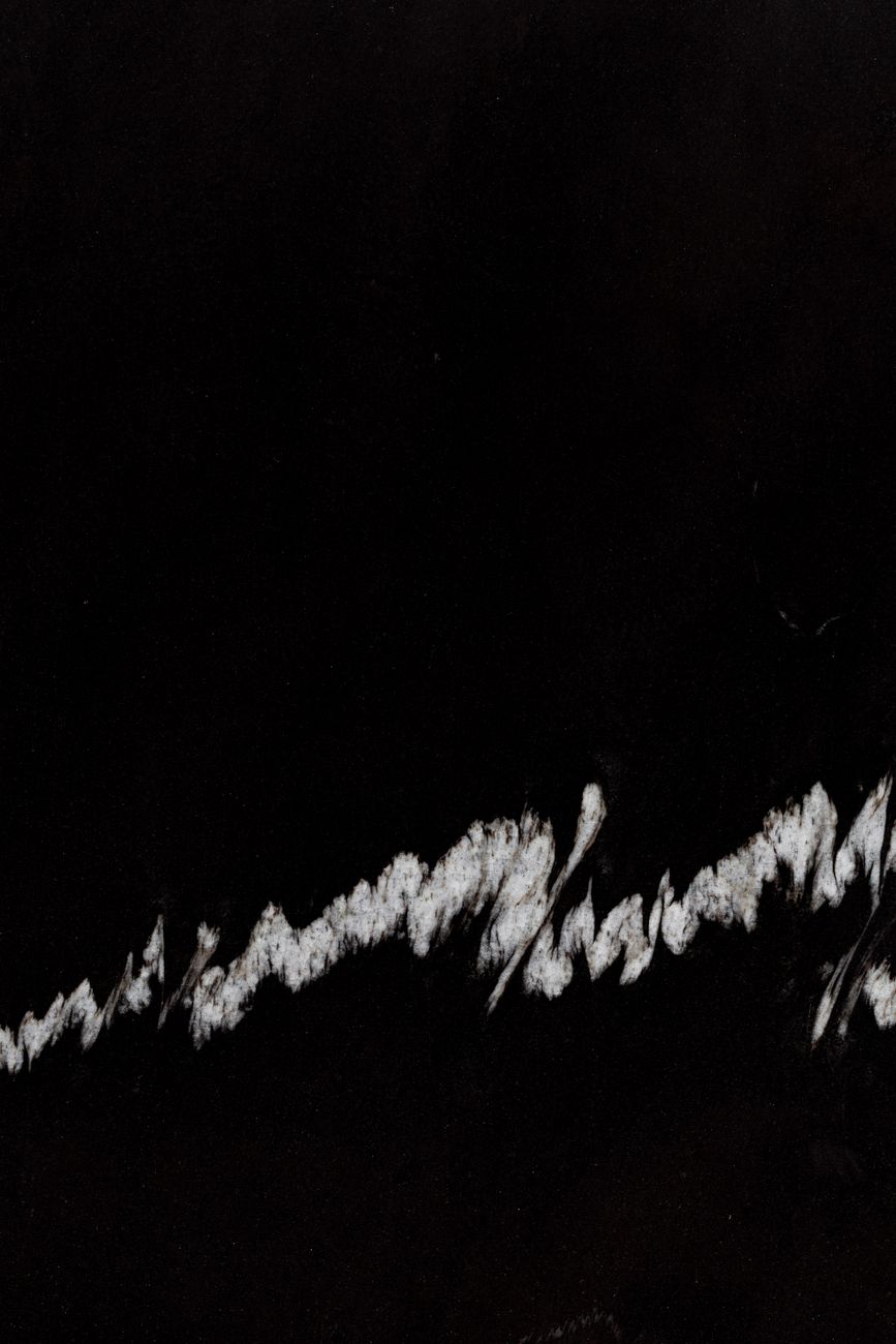 white stains on black background