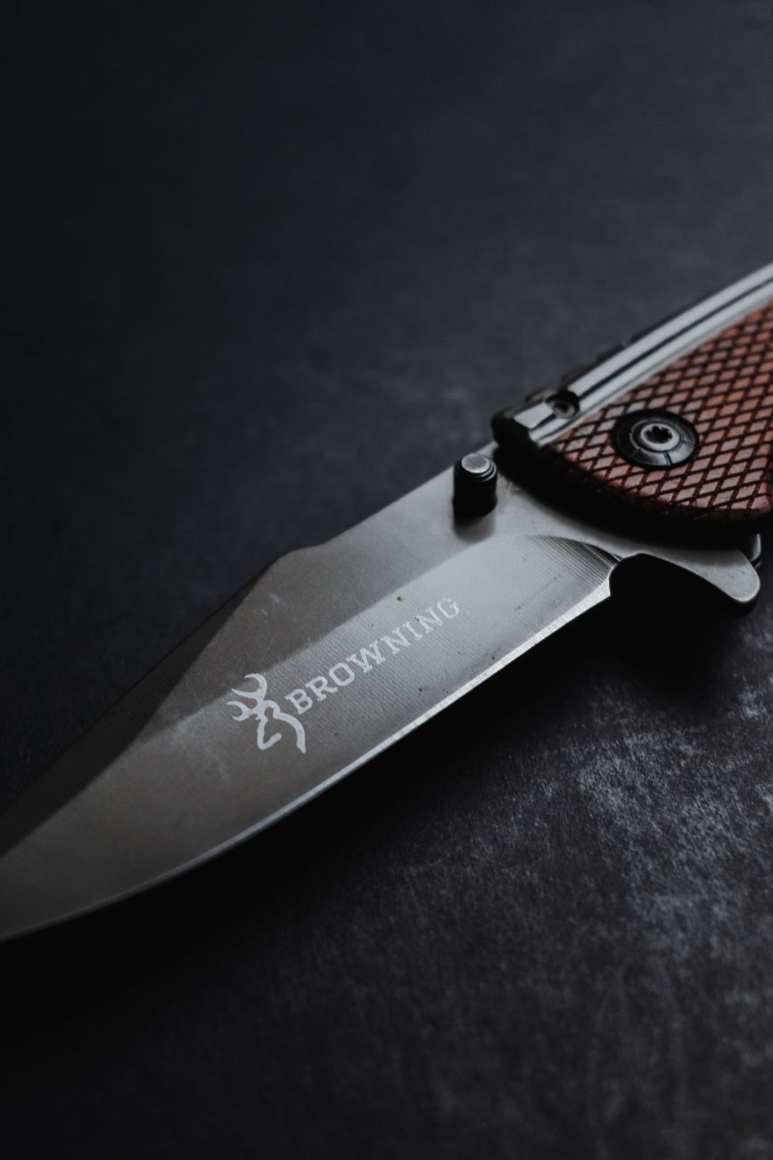 close up shot of a pocket knife with brown handle