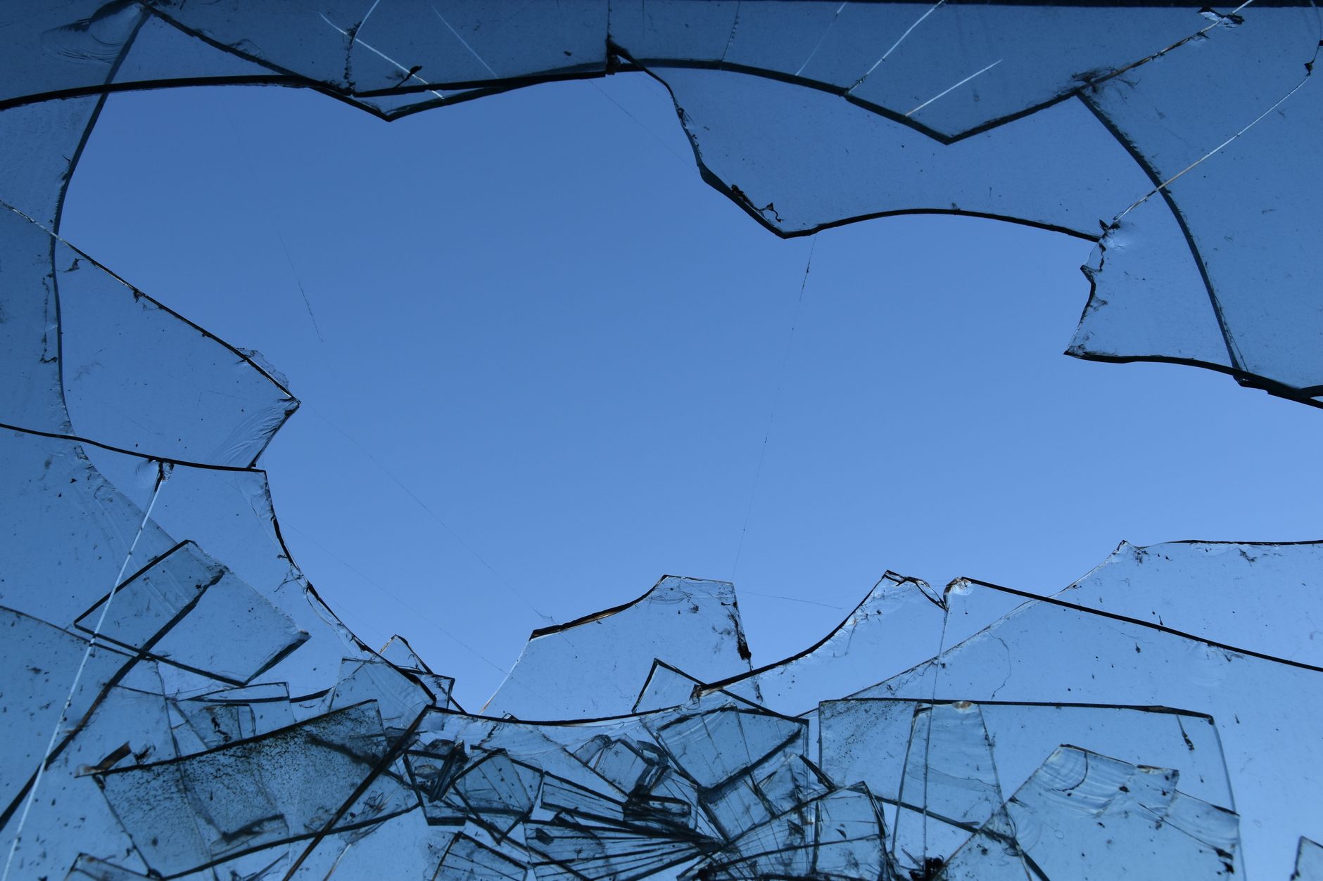 shattered glass against sky