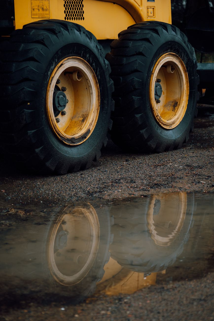 close up of heavy machinery tires with reflection