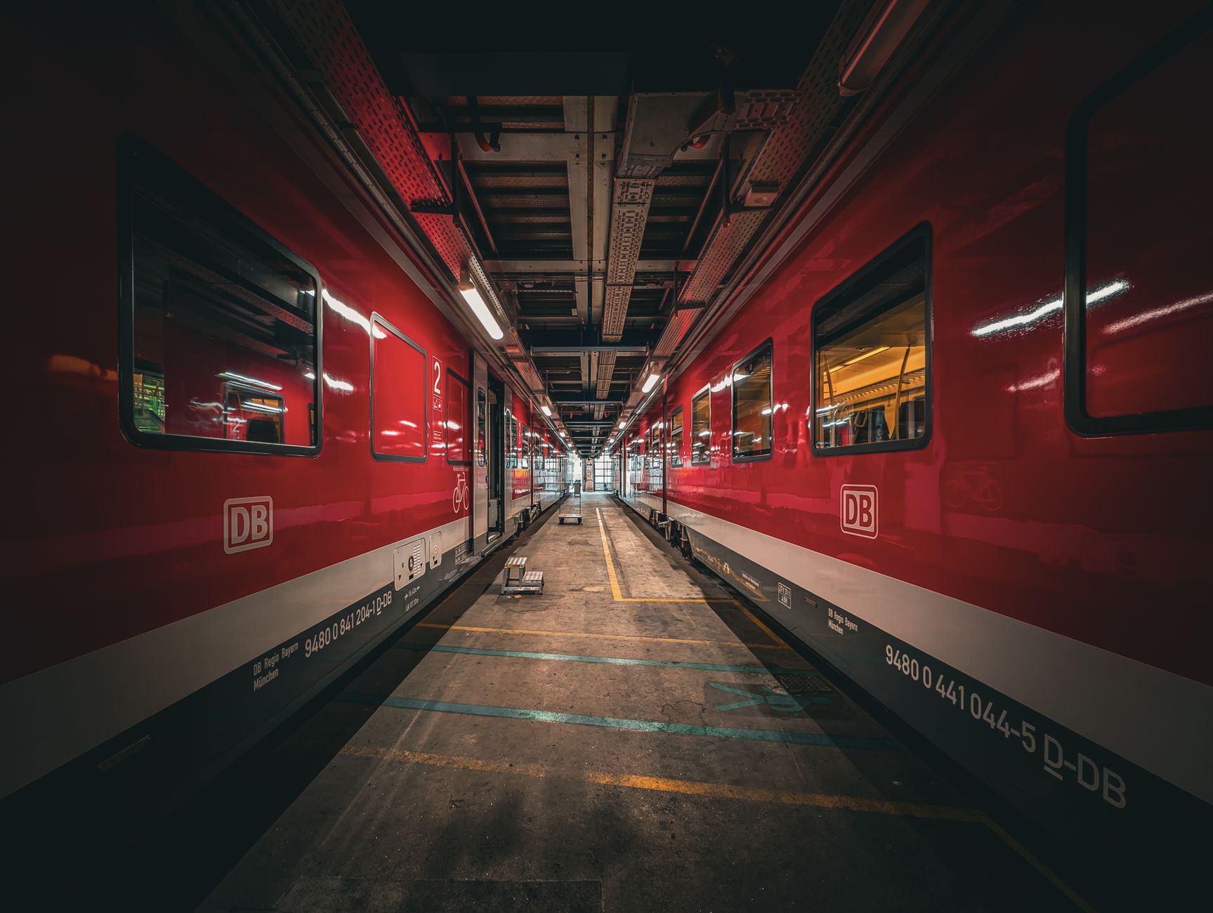 red deutsche bahn trains in munich workshop