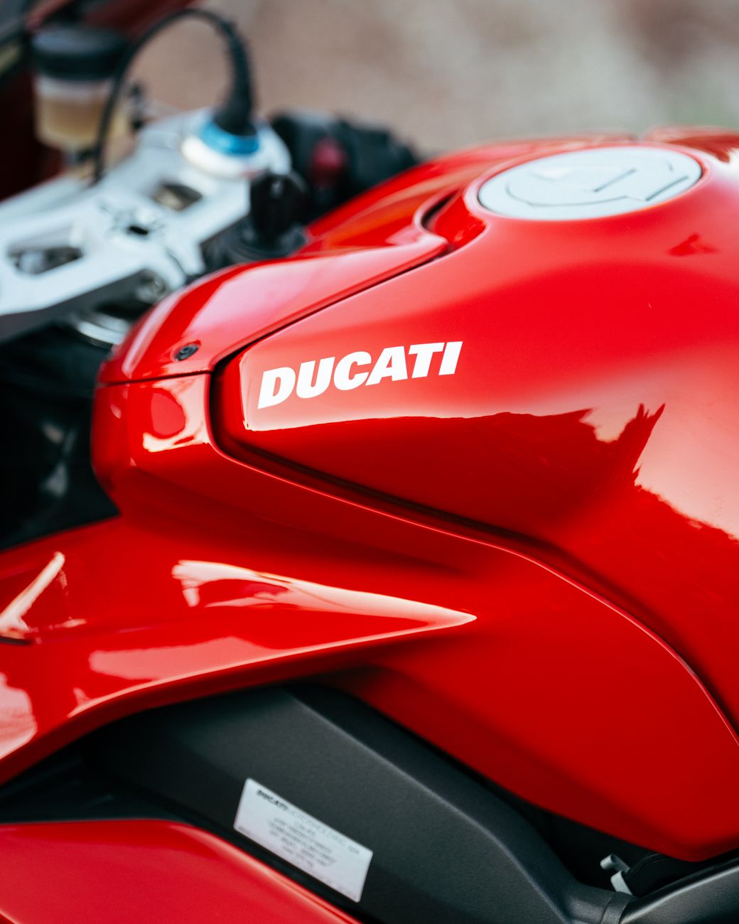 close up of red ducati motorcycle tank