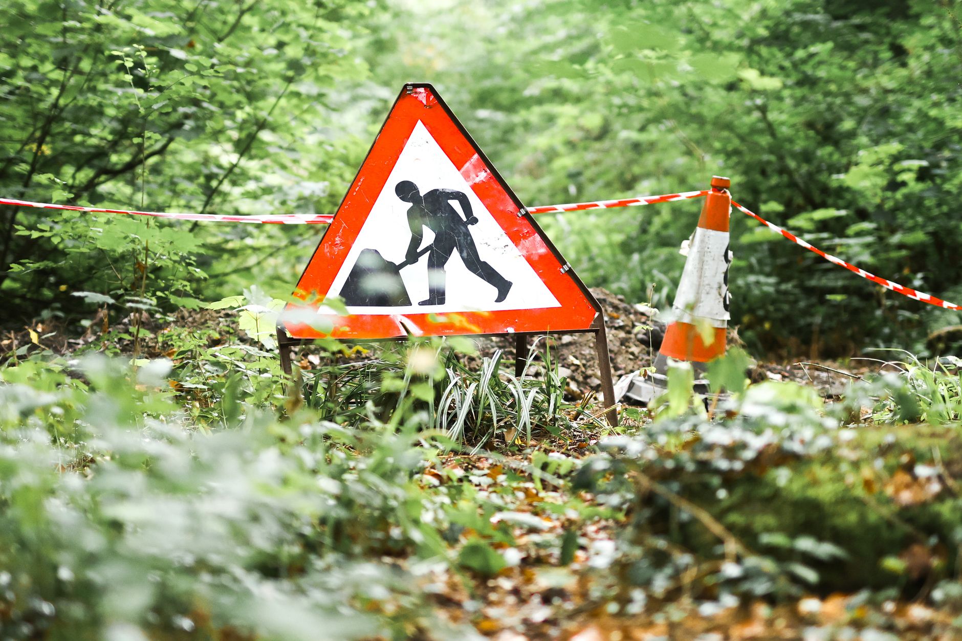 construction sign amidst lush greenery in ironbridge