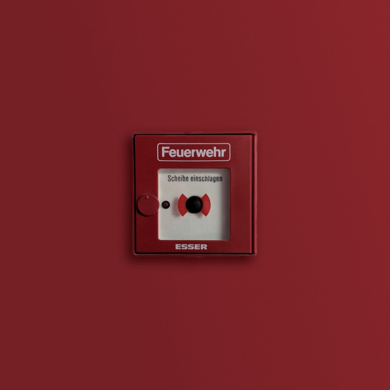 red and white fire alarm