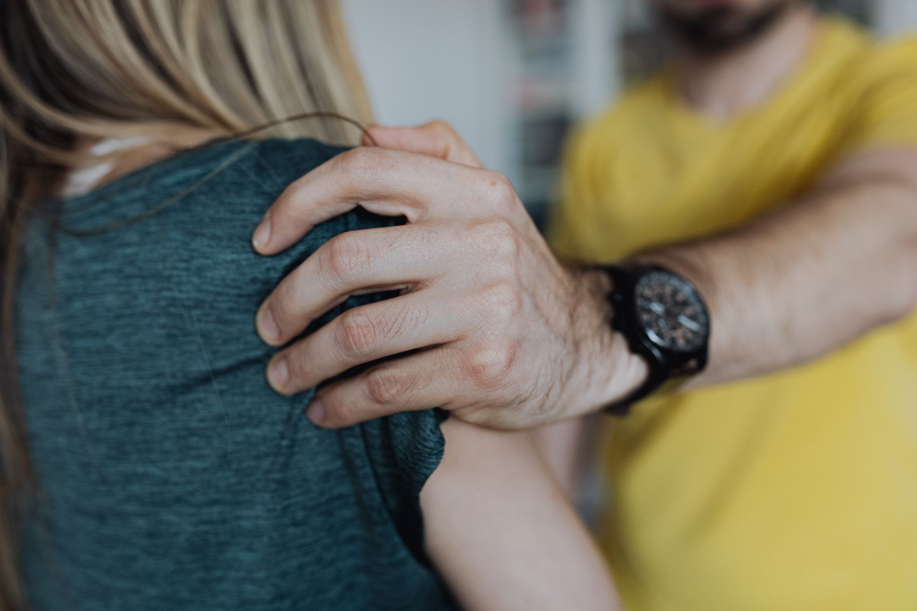 male hand holding woman