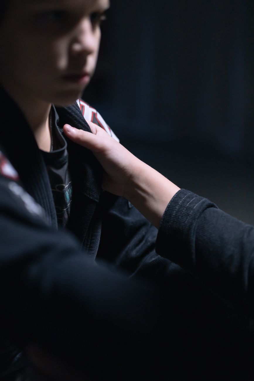 a person wearing black gi