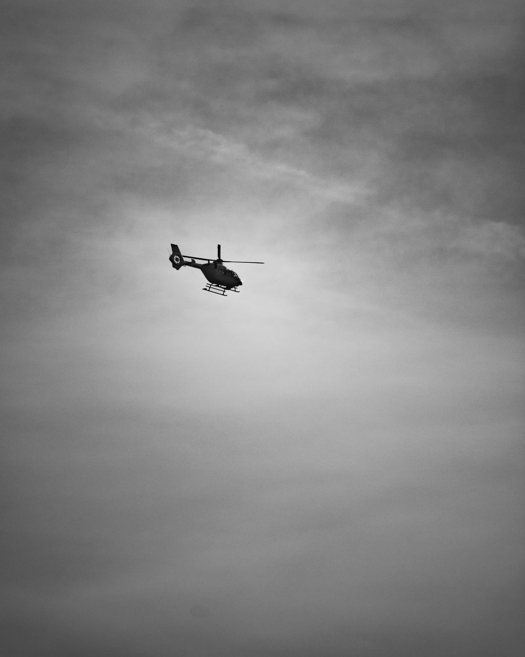 grayscale photo of airplane in mid air