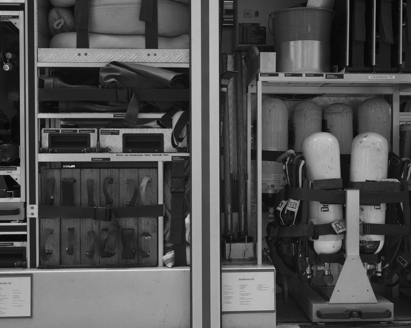 black and white photo of the equipment in a firetruck