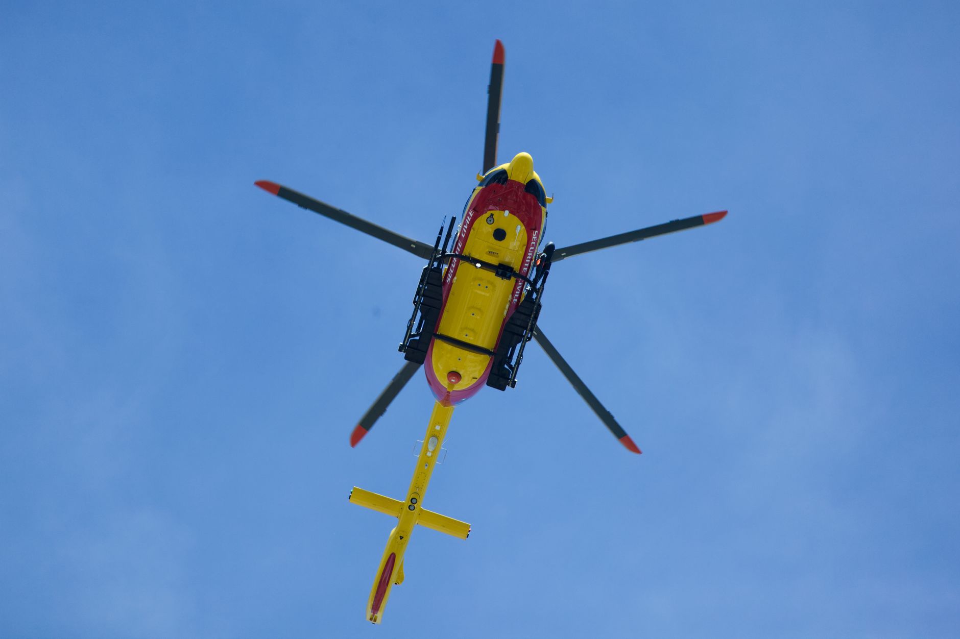 a helicopter in the blue sky